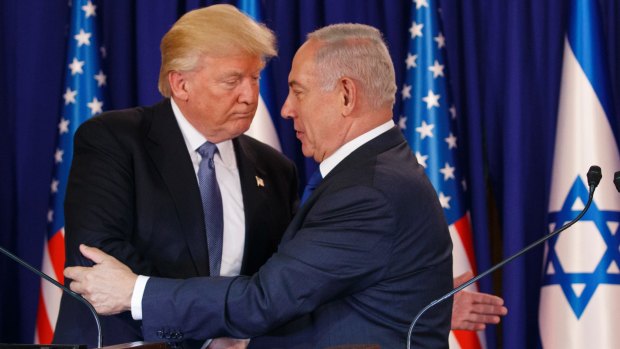 US President Donald Trump shakes hands with Israeli Prime Minister Benjamin Netanyahu.