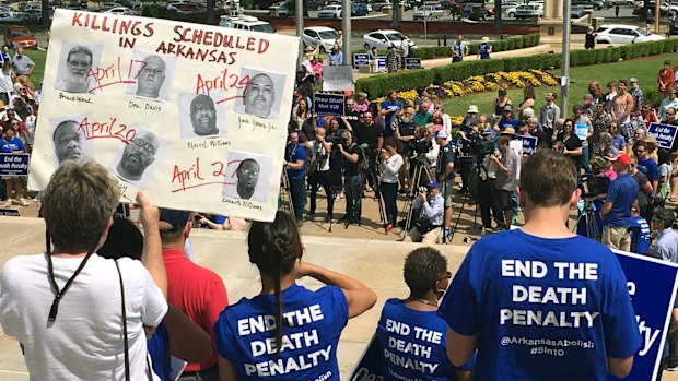 Protesters gather outside the state Capitol building on Friday.