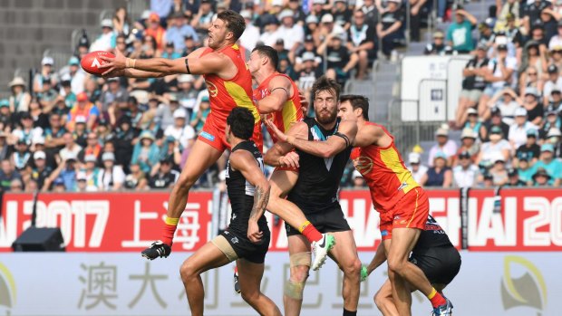 Port Adelaide and Gold Coast play in Shanghai last year.