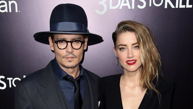 Time to enlist the help of Johnny Depp? The actor, seen here with partner Amber Heard, has donned thick-rimmed glasses in recent years.