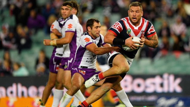 Hold on there: Jared Waerea-Hargreaves of the Roosters tries to evade Storm captain Cameron Smith.