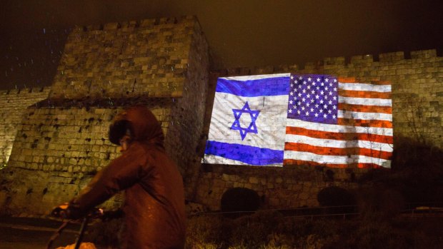 US and Israeli flags are projected on the walls of Jerusalem's occupied Old City in celebration on Wednesday. 