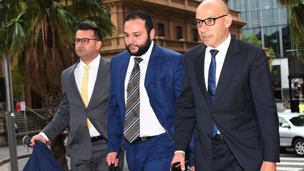 Moses Obeid, right, arrives at the NSW Supreme Court in Sydney with his legal team on Friday.