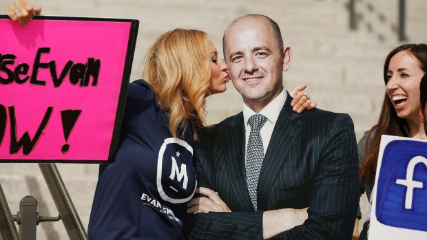 A voter pretends to kiss a cardboard cutout of Evan McMullin at a rally in Salt Lake City. 