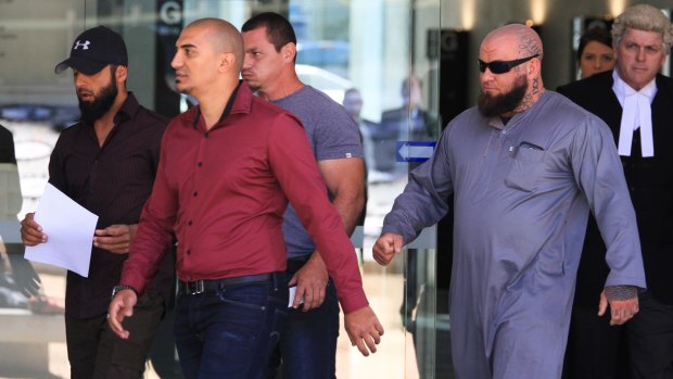 Supporters of Logan bookstore owner Omar Succarieh leave the Brisbane Supreme Court on Monday.