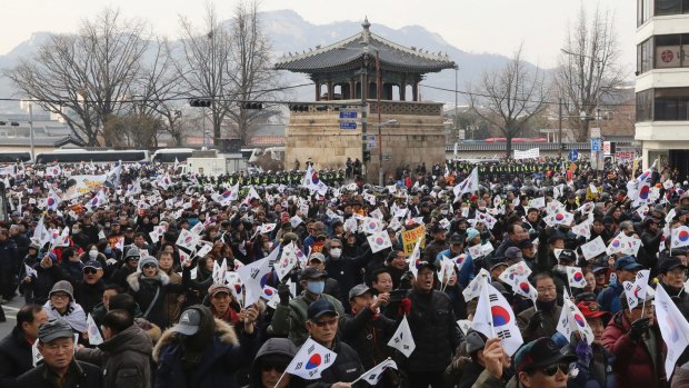 Supporters of impeached South Korean President Park Geun-hye march during a rally at downtown Seoul.