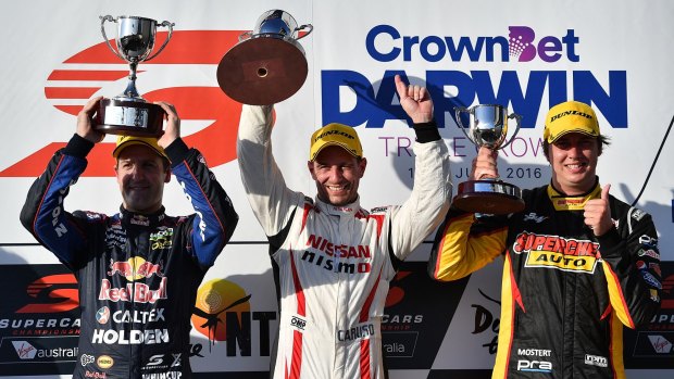 On the podium after race one of the Darwin Triple Crown are, from left: second-placed Jamie Whincup (Red Bull Racing Australia Holden Commodore VF), winner Michael Caruso (Nissan Motorsport Nissan Altima) and third-placed Chaz Mostert (Supercheap Auto Racing Ford Falcon FGX).  