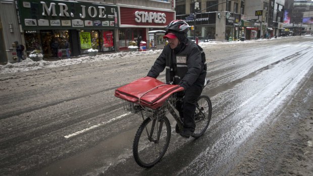 Long haul ... Lee and Carol Brown, who recently moved to Regina, Saskatchewan from Windsor, Ontario, will have their favourite pizza delivered by UPS, not by bicycle.
