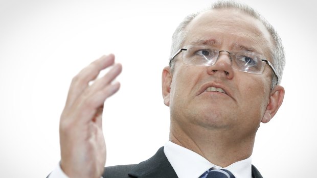 Treasurer Scott Morrison talks to the media at Parliament House on Friday.