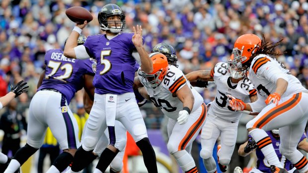Quarterback Joe Flacco threw two fourth-quarter touchdown passes to rally the Ravens past the Browns.