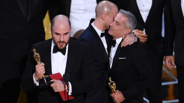 Jordan Horowitz, left, of "La La Land", mistakenly accepts the award for best picture at the Oscars.