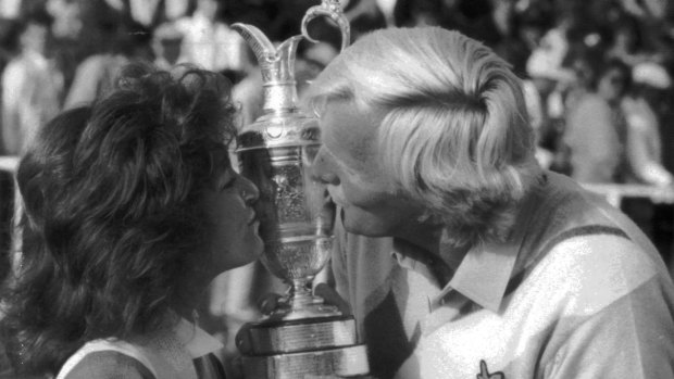 Sealed with a kiss: Greg Norman and his then wife, Laura, celebrate his British Open win in 1986