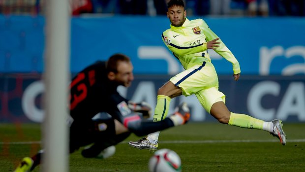 Barcelona striker Neymar slots the opening goal past Atletico Madrid goalkeeper Jan Oblak.