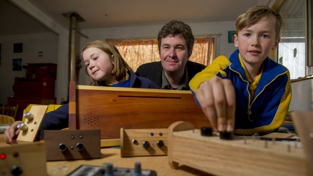 Brian McNamara with his electronic instruments and children Rhianna and Edgar.