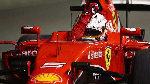 Germany's Sebastian Vettel celebrates after winning the Formula One Grand Prix in Singapore on September 20.