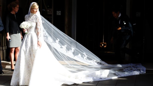 Nicky Hilton in her $100,000 Valentino lace wedding dress that mimicked the style of royal brides Kate Middleton and Grace Kelly.