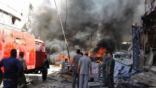 A fire burns after the attack in Sayyida Zeinab, Damascus.