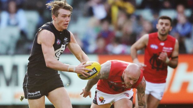 Patrick Cripps of the Blues gets away from Nathan Jones on Sunday.