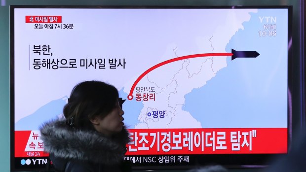 A TV news program reports North Korea's recent missile launch in Seoul, South Korea.