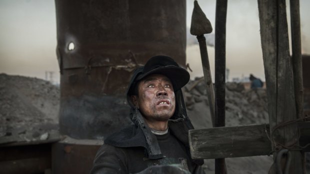 A Chinese labourer works at an unauthorised steel factory in Inner Mongolia, China.  Pollution levels in neighbouring Mongolia are even worse than in the Chinese autonomous region.