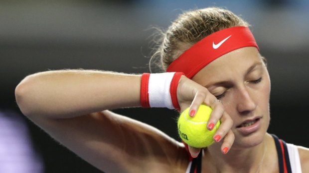 Feeling the heat ... Petra Kvitova wipes sweat from her face during her second round loss to Daria Gavrilova.