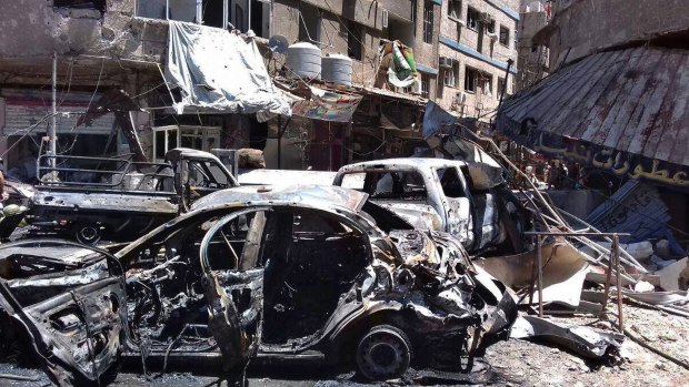 Burnt out cars after the attack in Sayyida Zeinab, Damascus.