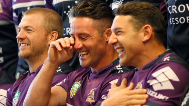 This is serious, Melbourne: Cooper Cronk shares a laugh with Ryan Hinchcliffe and Billy Slater at the team photo shoot on Wednesday.