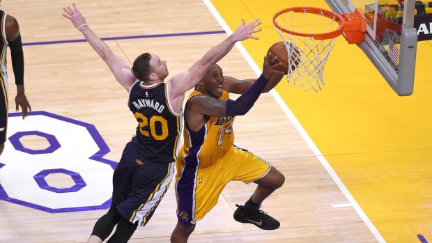 Los Angeles Lakers forward Kobe Bryant  shoots as Utah Jazz forward Gordon Hayward defends.