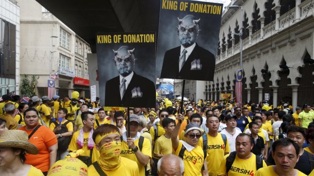 Supporters of pro-democracy group Bersih march down Jalan Tun Perak in Malaysia's capital city of Kuala Lumpur.