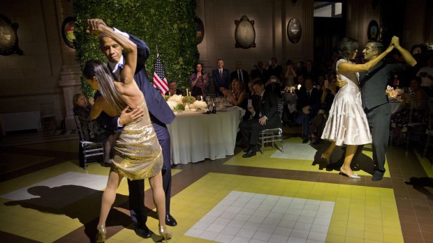 President Barack Obama and First Lady Michelle Obama, right, dance the tango with professional dancers at the state dinner in Buenos Aires on Wednesday.