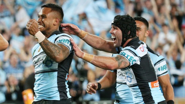 Surprise move: Ben Barba, Michael Ennis and Valentine Holmes celebrate the fullback's opening try in the 2016 grand final.