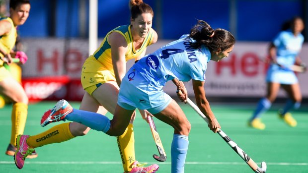 India's Monika controls the ball  during her side's loss to Australia.