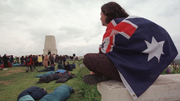 Flag-draped visitors to the Lone Pine memorial during Anzac Day commemorations.