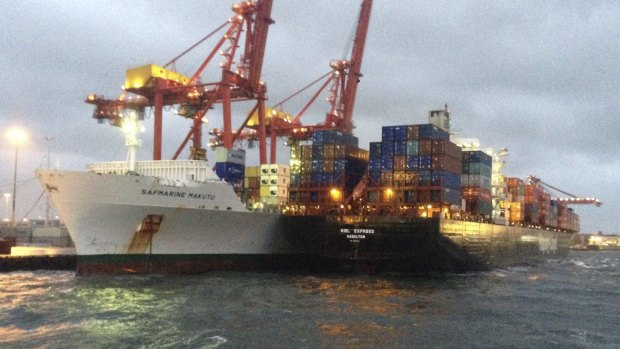 The vessels sit side-by-side after wind blew the Hapag-Lloyd vessel from its moorings.