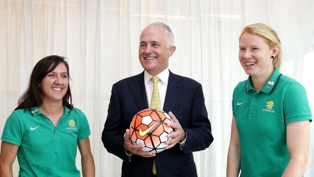 Support: Prime Minister Malcolm Turnbull with Matildas co-captains Lisa De Vanna and Clare Polkinghorne.