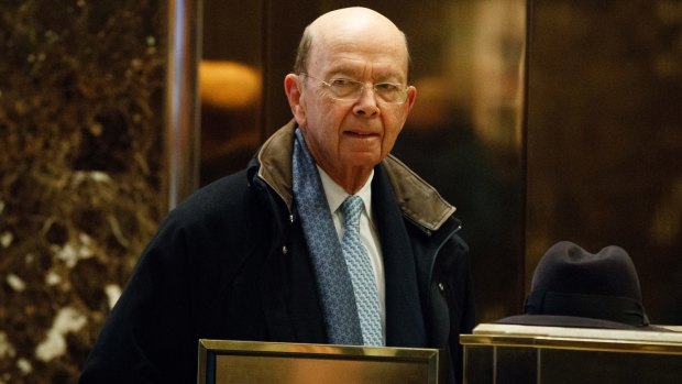 Commerce Secretary-designate Wilbur Ross waits for an elevator at Trump Tower in New York.