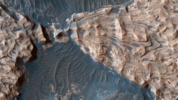 This image from NASA's Mars Reconnaissance Orbiter shows an ancient impact crater. Scientists suggest it once held a lake.