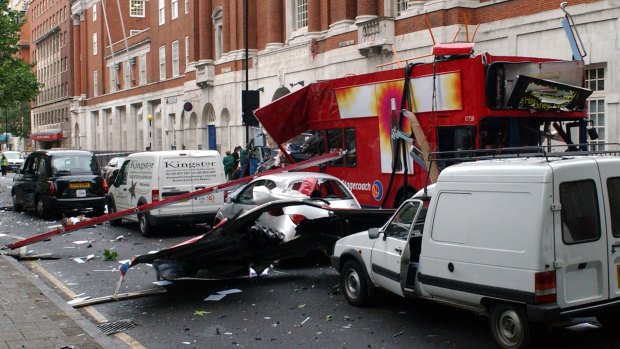 A wrecked double-decker London bus, with its roof blown off after a blast in London. 