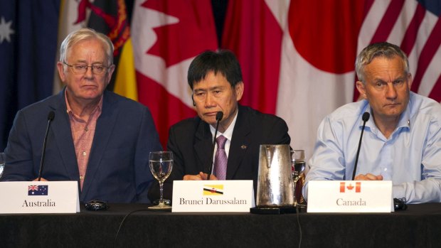 Trade Minister Andrew Robb, left, with counterparts from Brunei Lim Jock Hoi and Canada Ed Fast at the closing press conference.