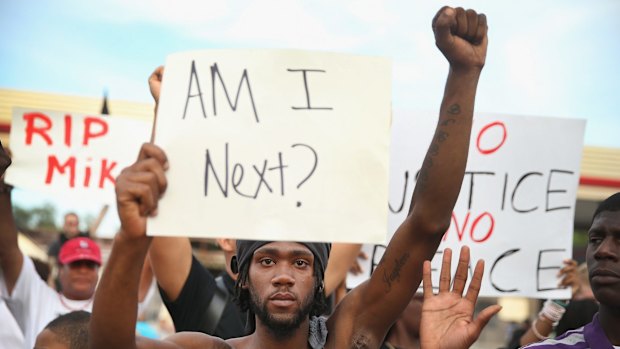 Protesters take to the streets in Ferguson in August.