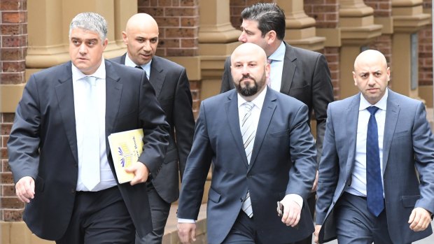 From left, lawyer Nick di Girolamo, Moses Obeid, Eddie Obeid jnr, lawyer Tim Breene (back) and Paul Obeid at the Supreme Court last year.