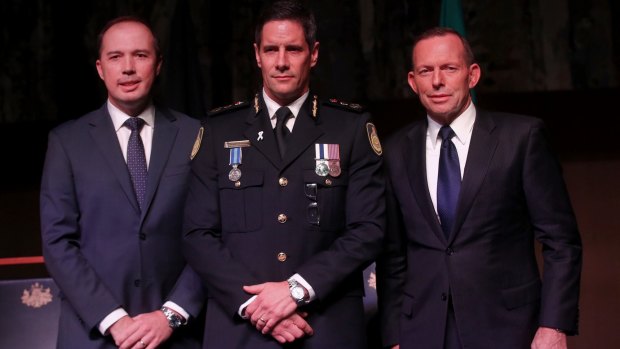 Australian Border Force commissioner Roman Quaedvlieg, centre, with Peter Dutton and then prime minister Tony Abbott.