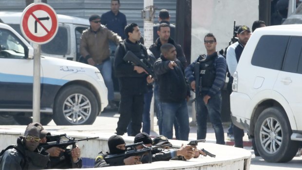 Police officers outside Parliament in Tunis.