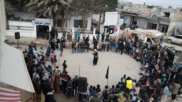 A shot from an IS propaganda website shows a street preaching event at Tel Abyad town in Raqqa province, north-east Syria. 