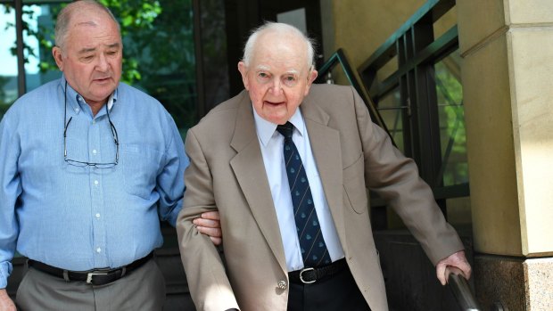 Lawrence Fitzpatrick, (right) leaves the Melbourne Magistrates Court after a hearing in March.