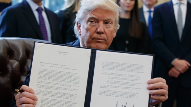 President Donald Trump shows off his signature on an executive order about the Dakota Access pipeline on Tuesday. Oh dear, our apologies, our mistake! This was when he came down from Mount Sinai with the tablets!