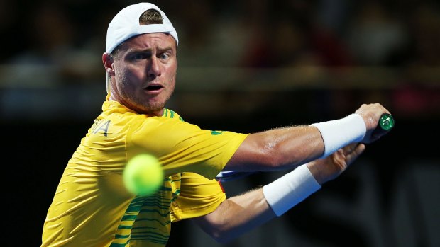 Big crowd: Lleyton Hewitt plays a backhand during the exhibition in front of 11,000 people.