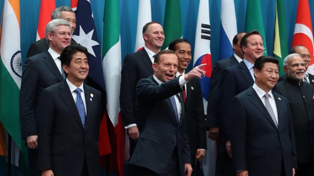 Prime Minister Tony Abbott poses with the G20 leaders for the "family" photo in Brisbane.