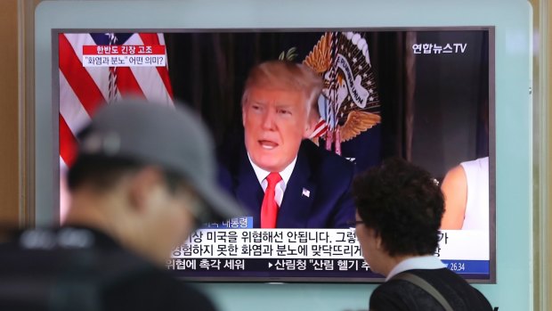 A local news program broadcasts Donald Trump's remarks at the Seoul Train Station in South Korea.