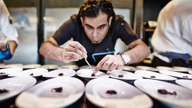 Chef Gaggan Anand plates for service. 